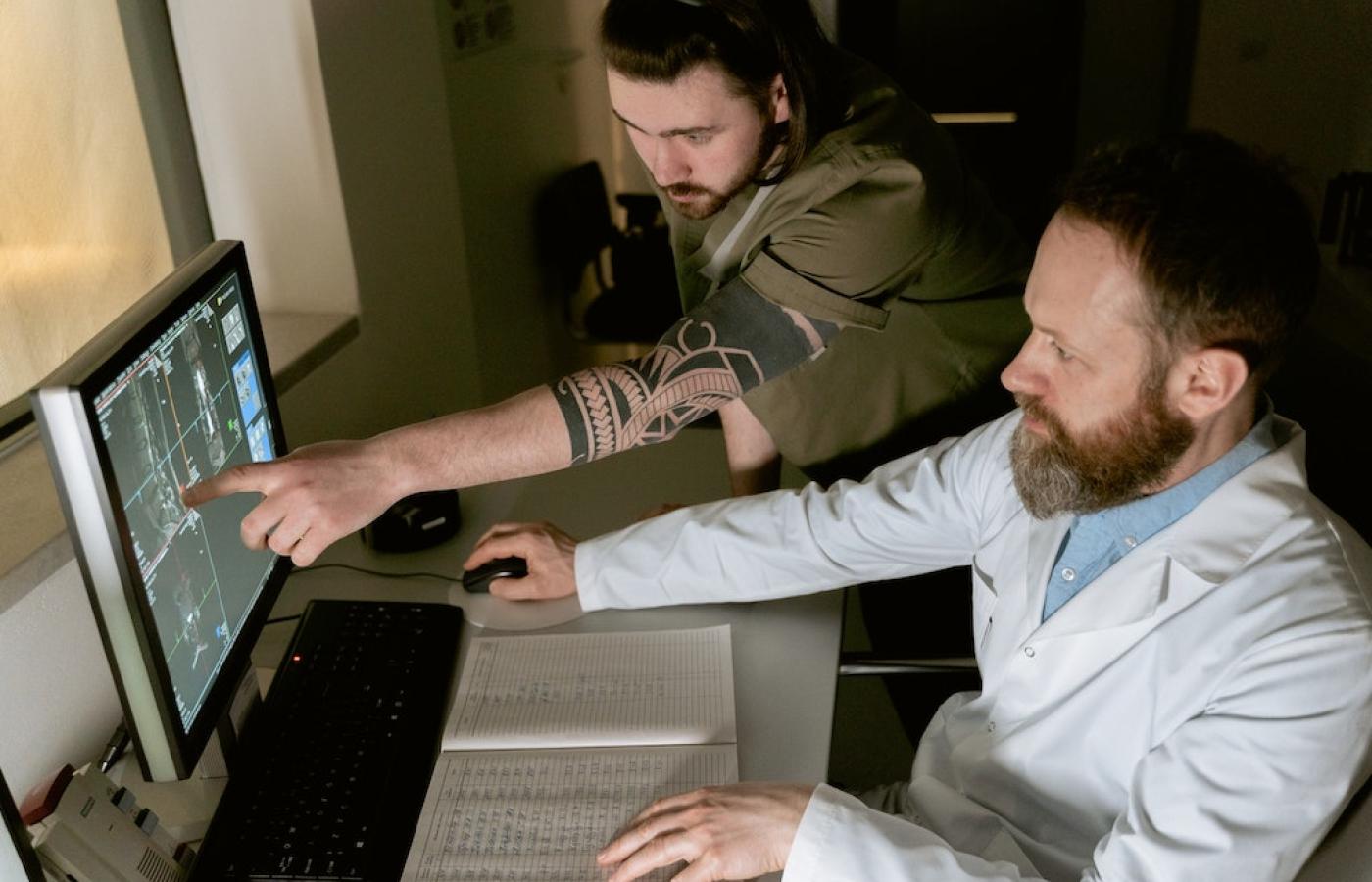 Scientists working on a computer